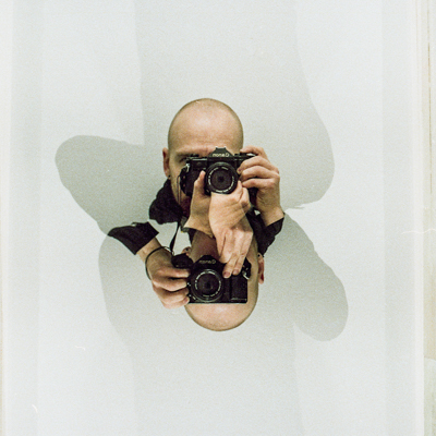 Double exposure self portrait, 2019. Canon A1, Lomo 800.
